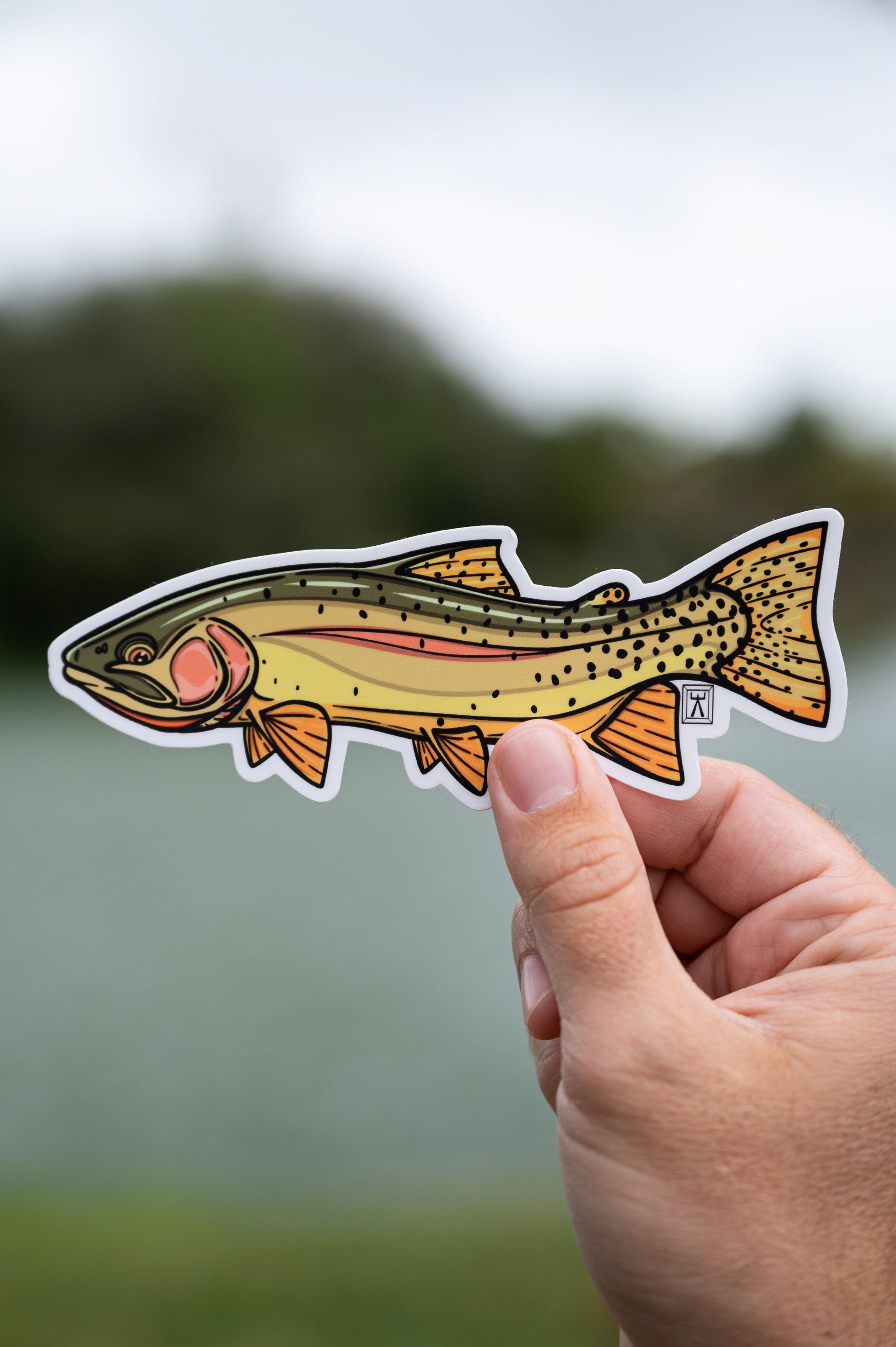Hand holding cutthroat sticker