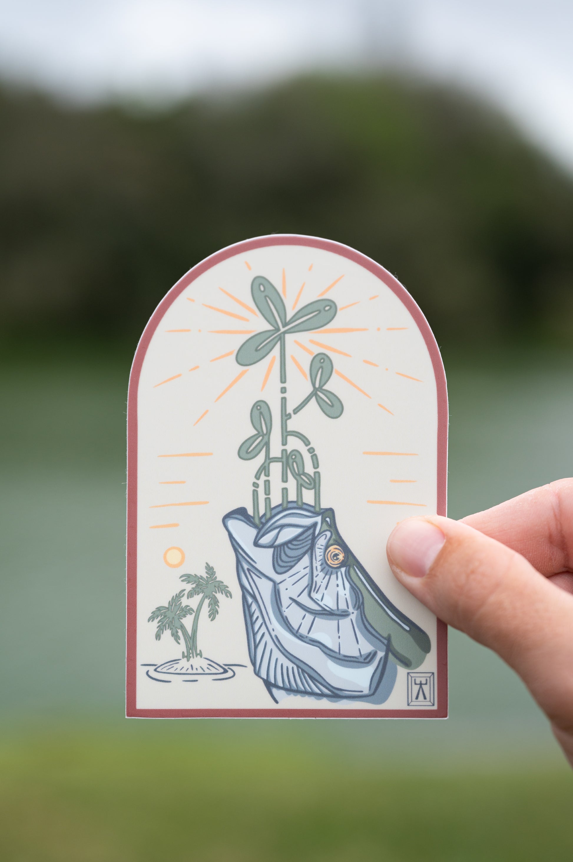 Hand holding mangrove backcountry tarpon sticker