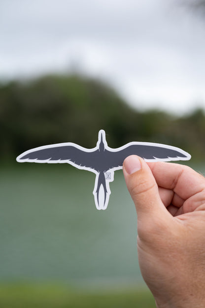 Hand holding frigatebird sticker